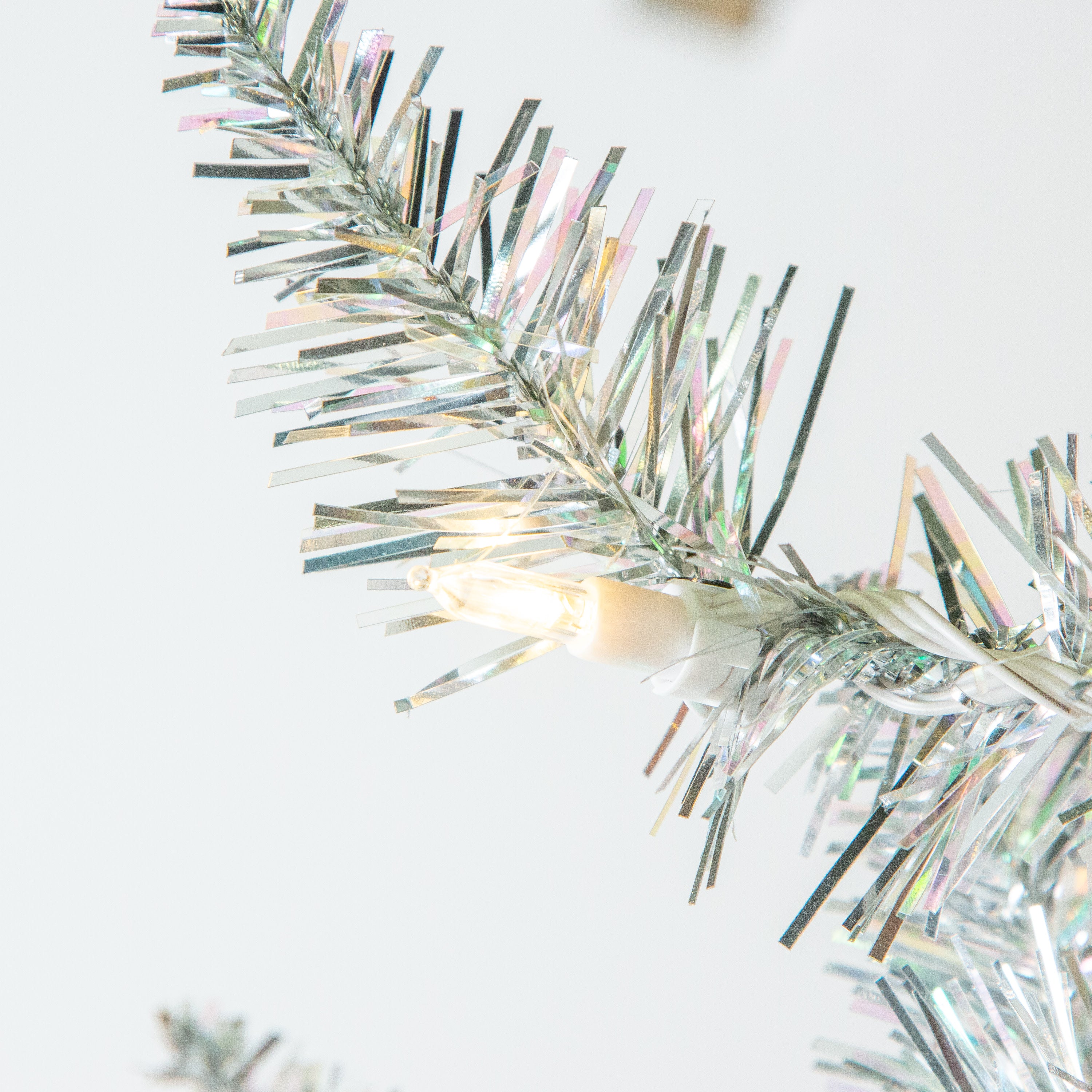 Sterling Elegant 5 Foot Slim Silver Tinsel Tree with Warm White LED Lights